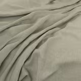 Muted sage-grey plain weave falling in soft, fluid folds