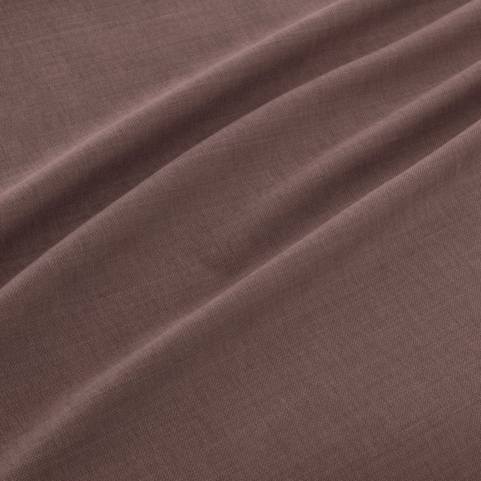 Muted aubergine plain weave falling into soft diagonal folds