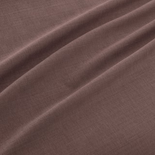 Muted aubergine plain weave falling into soft diagonal folds
