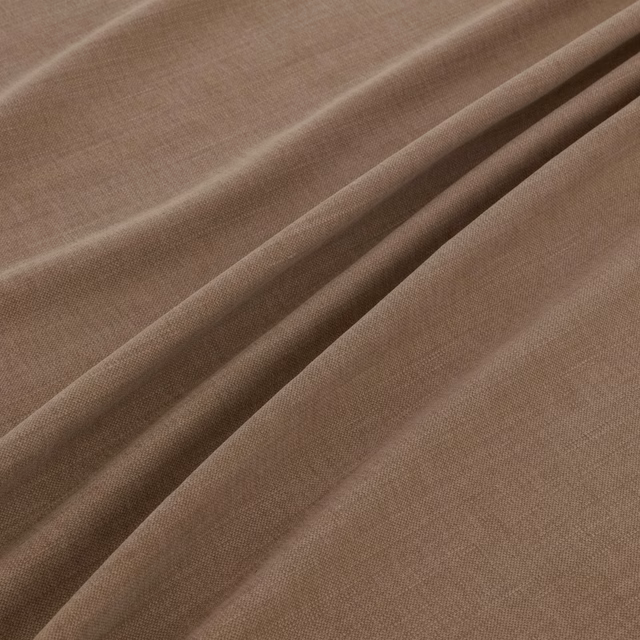 Warm cappuccino taupe woven fabric draped in folds with a fine even texture