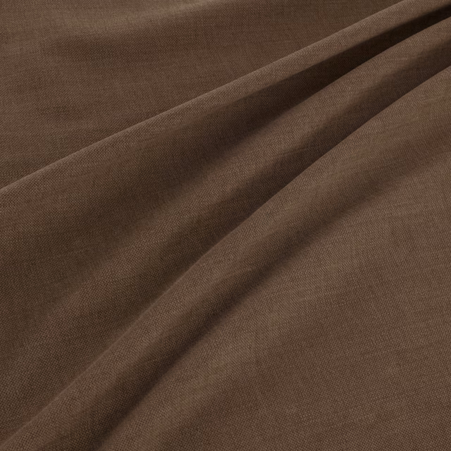 Chocolate-brown plain weave fabric shown in soft diagonal folds