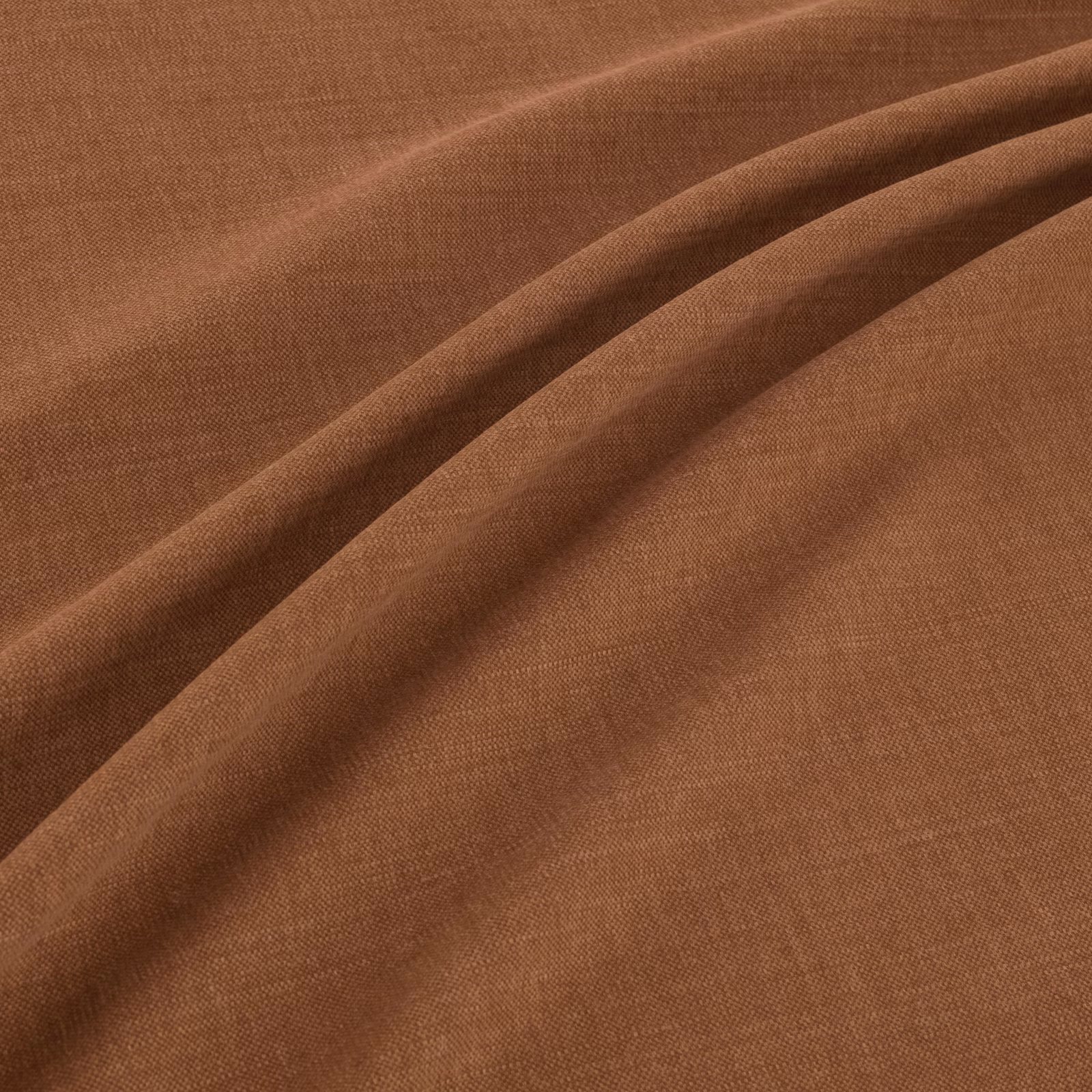 Warm cognac-brown plain weave fabric shown in soft folds with subtle tonal shading