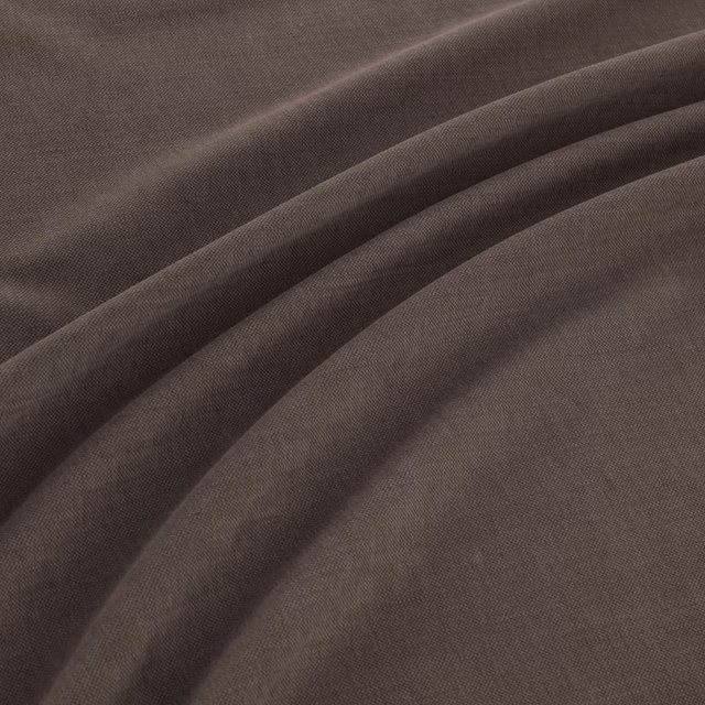 Dark espresso-brown woven fabric shown in softly folded draped layers
