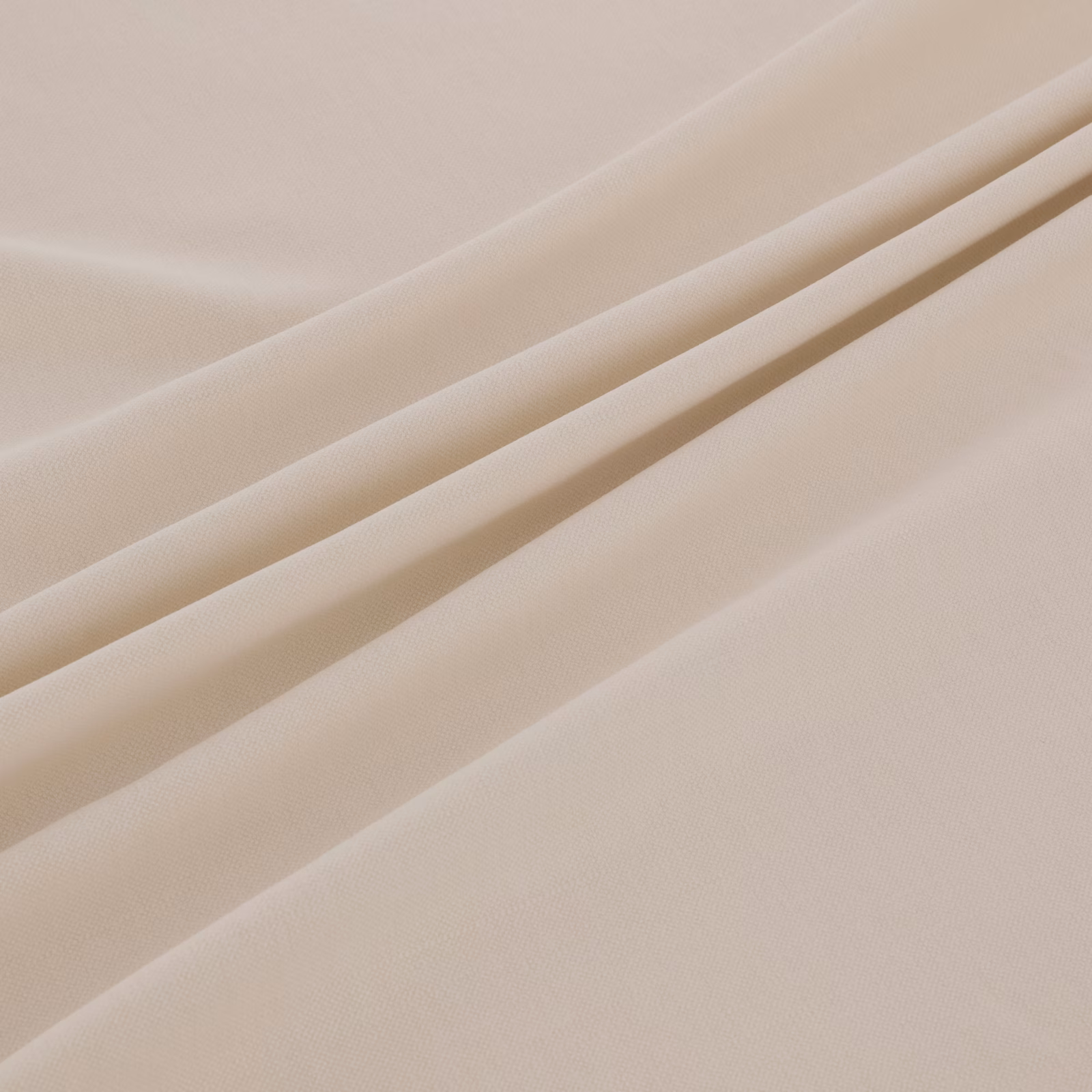 Warm ivory fine weave shown in soft diagonal folds with subtle linear texture