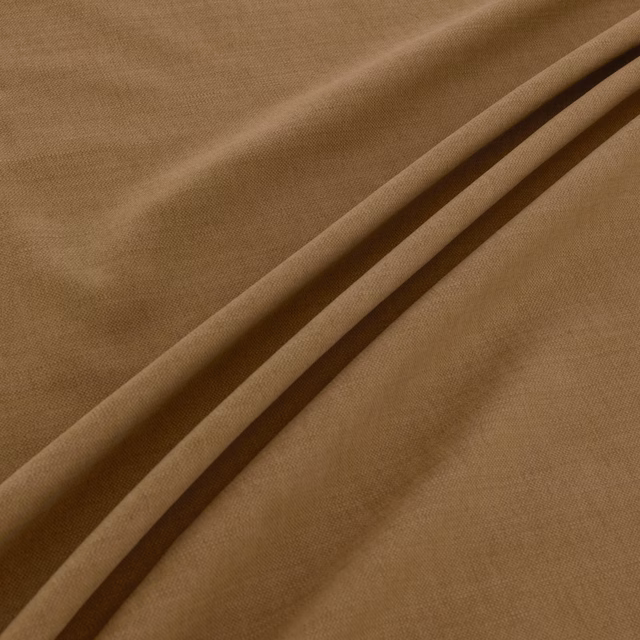 Warm khaki-brown plain weave fabric folded to show fine texture and shaded creases