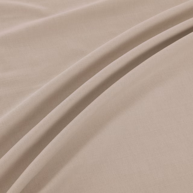 Warm oyster plain-weave fabric shown in soft, fluid diagonal folds