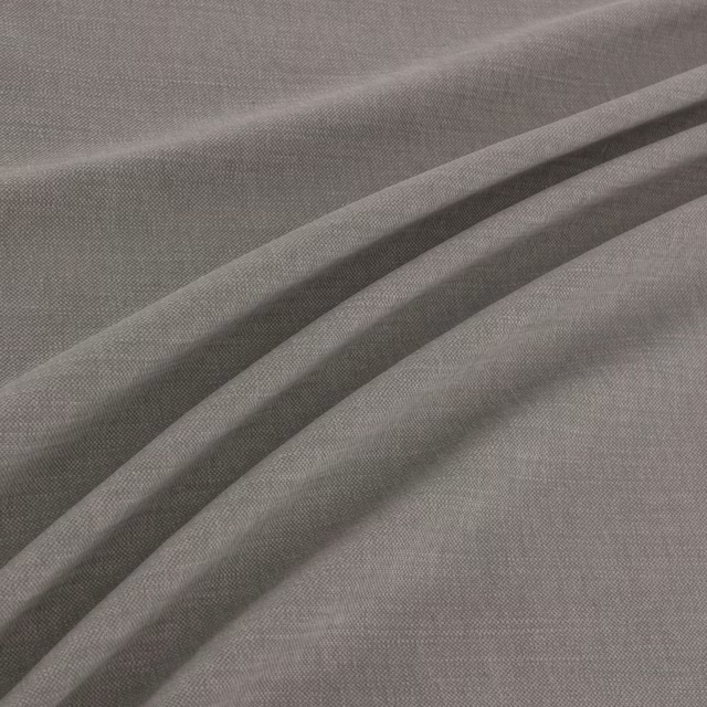 Muted plum-grey finely woven fabric gathered into soft, fluid folds