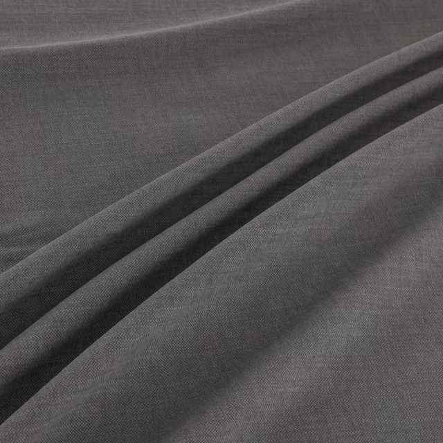 Cool slate-grey plain weave with fine texture gathered into soft diagonal folds
