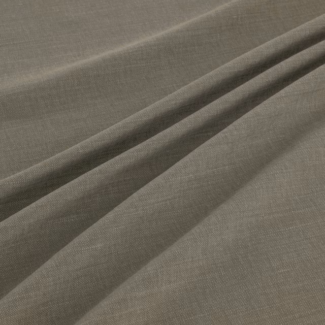 Muted olive-taupe plain weave fabric gathered into softly fluid folds