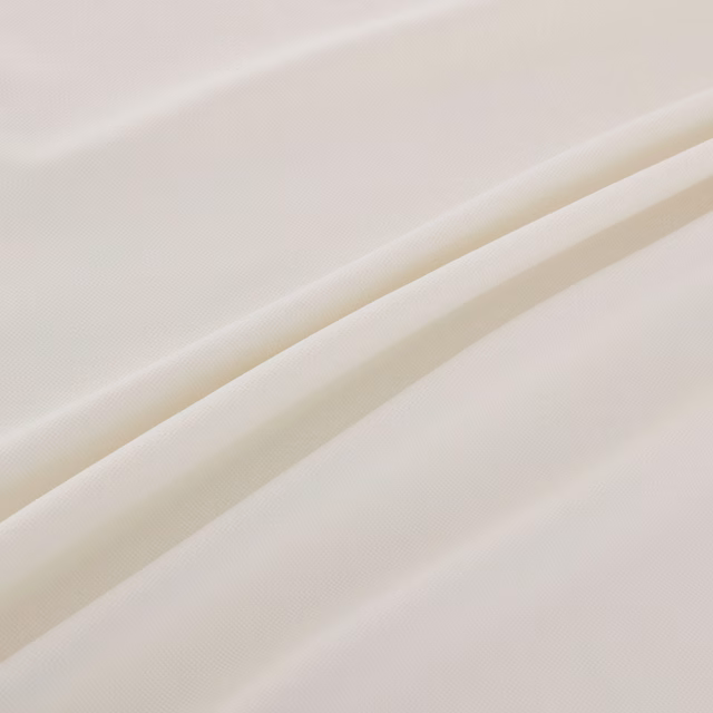 Soft ivory-white finely woven fabric falling into broad diagonal folds