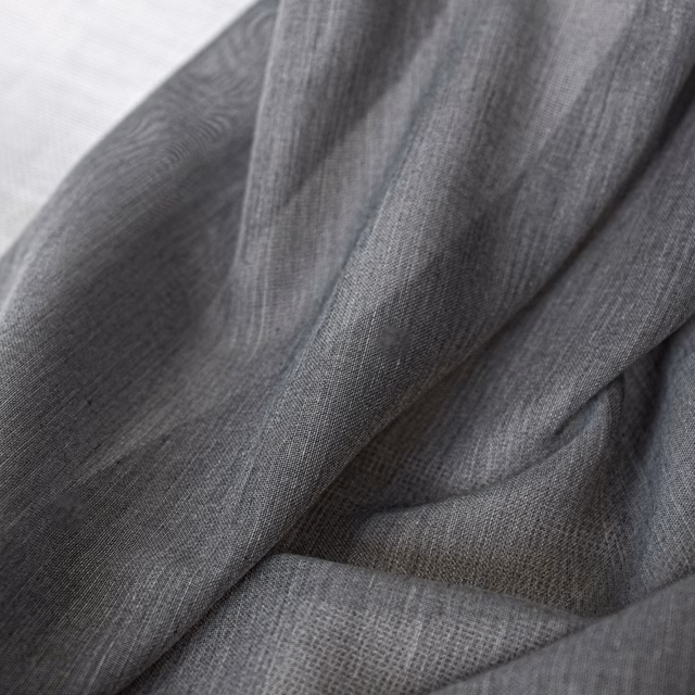 Deep mercury-grey woven fabric with fine linear texture in softly folded close-up.