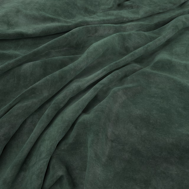 Folded plain velvet in deep emerald green showing plush, softly varied nap