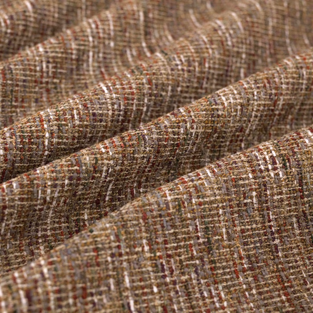 Warm taupe-brown woven textile with rust flecks and softly raised ridges