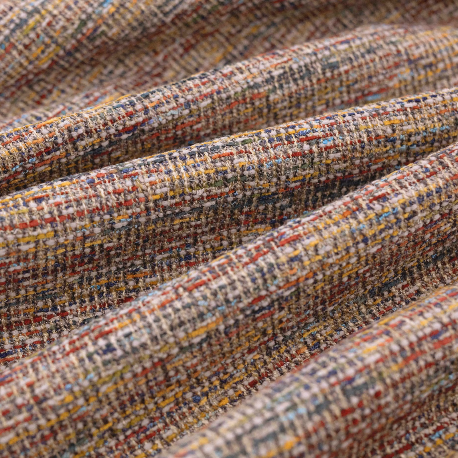 Close-up of Madison Multi’s chunky woven check in rust, mustard, blue and grey