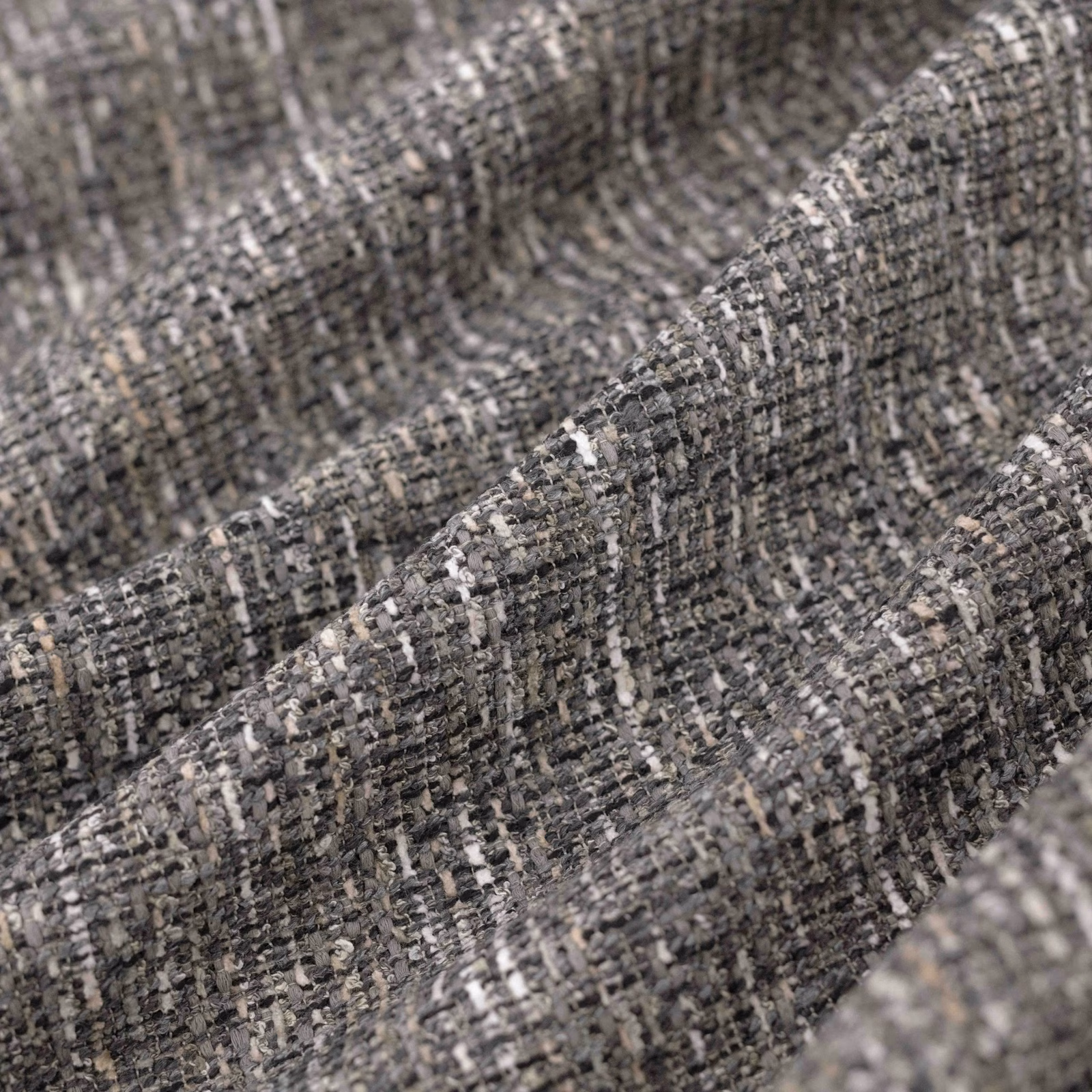 Close-up of Madison Storm’s charcoal-grey irregular weave with pale flecks and raised texture