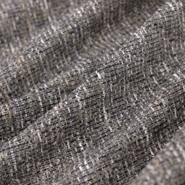 Close-up of Madison Storm’s charcoal-grey irregular weave with pale flecks and raised texture