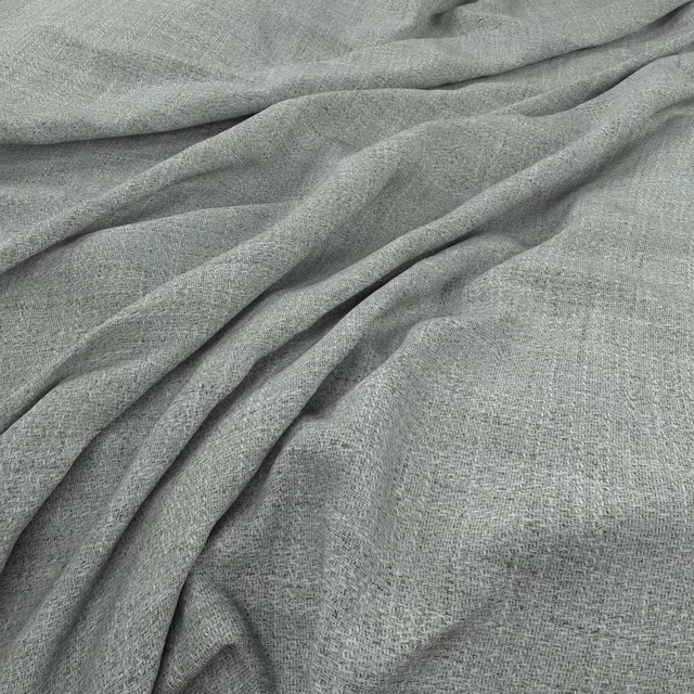 Close-up of muted seafoam green fabric with fine weave and soft flowing folds