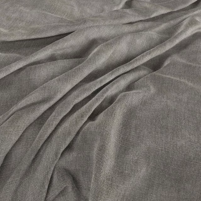 Cool asphalt-grey fabric showing fine crosshatch weave in soft fluid folds