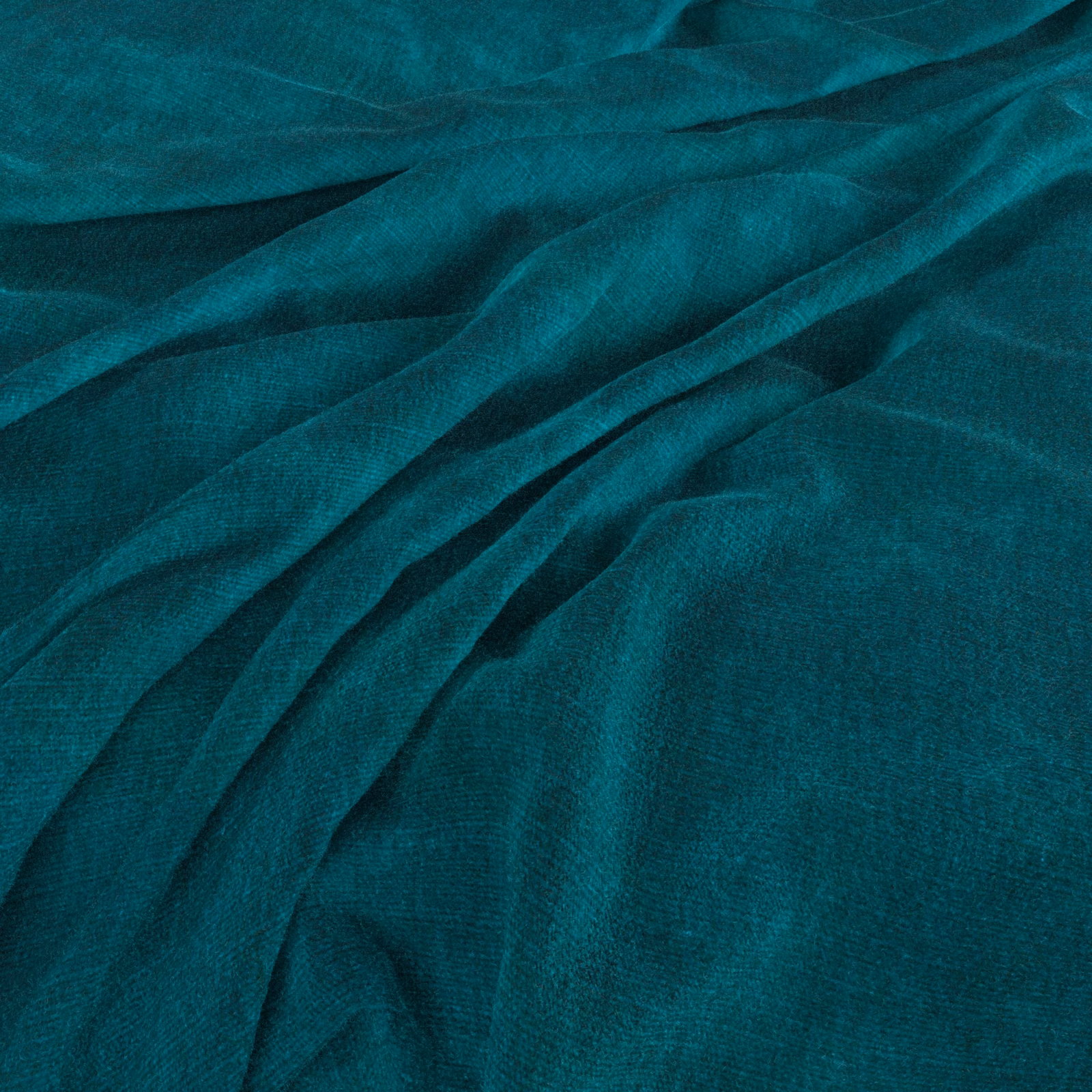 Deep kingfisher teal textile with fine woven texture gathered into soft folds