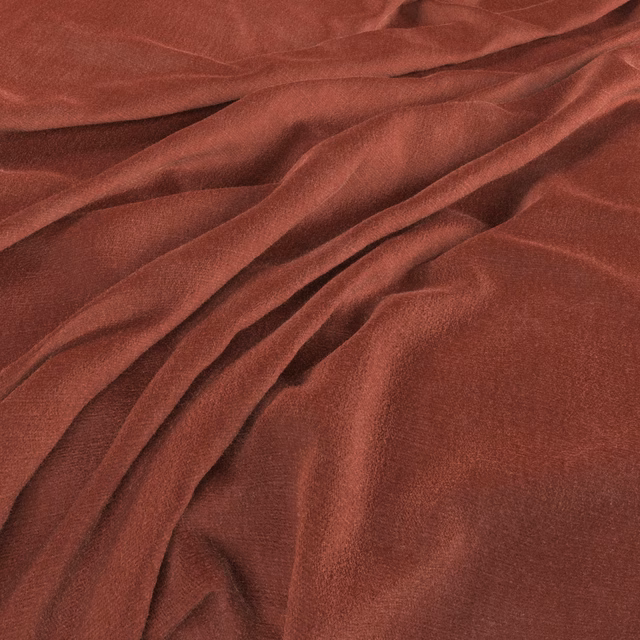 Warm madder-red woven cloth falling in soft, fluid folds