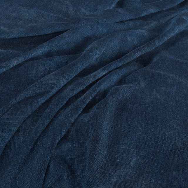 Deep navy woven fabric with softly mottled texture and relaxed folds