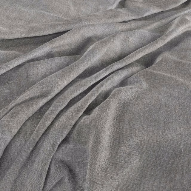Cool storm-grey fine weave falling into soft, fluid diagonal folds