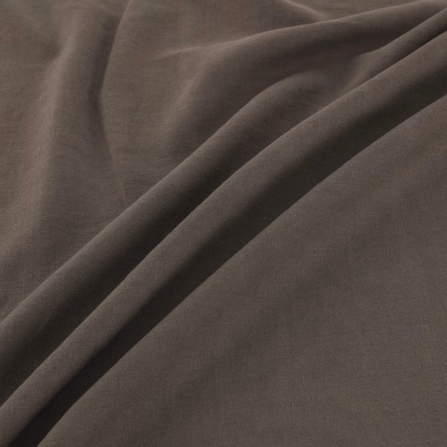 Deep bitter taupe plain-woven fabric folded to show soft fluid drape