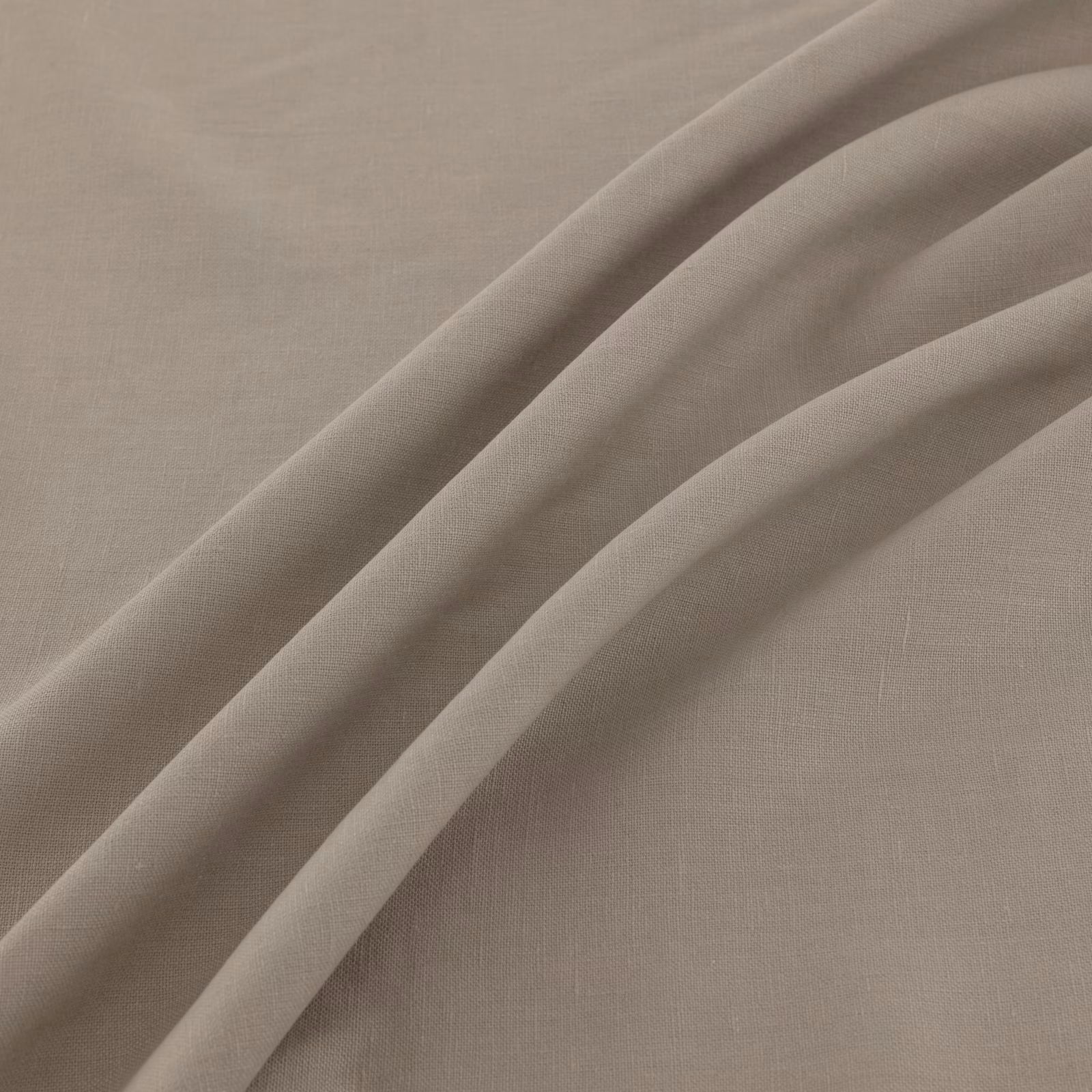 Warm taupe plain-weave textile draped in broad, softly shadowed folds