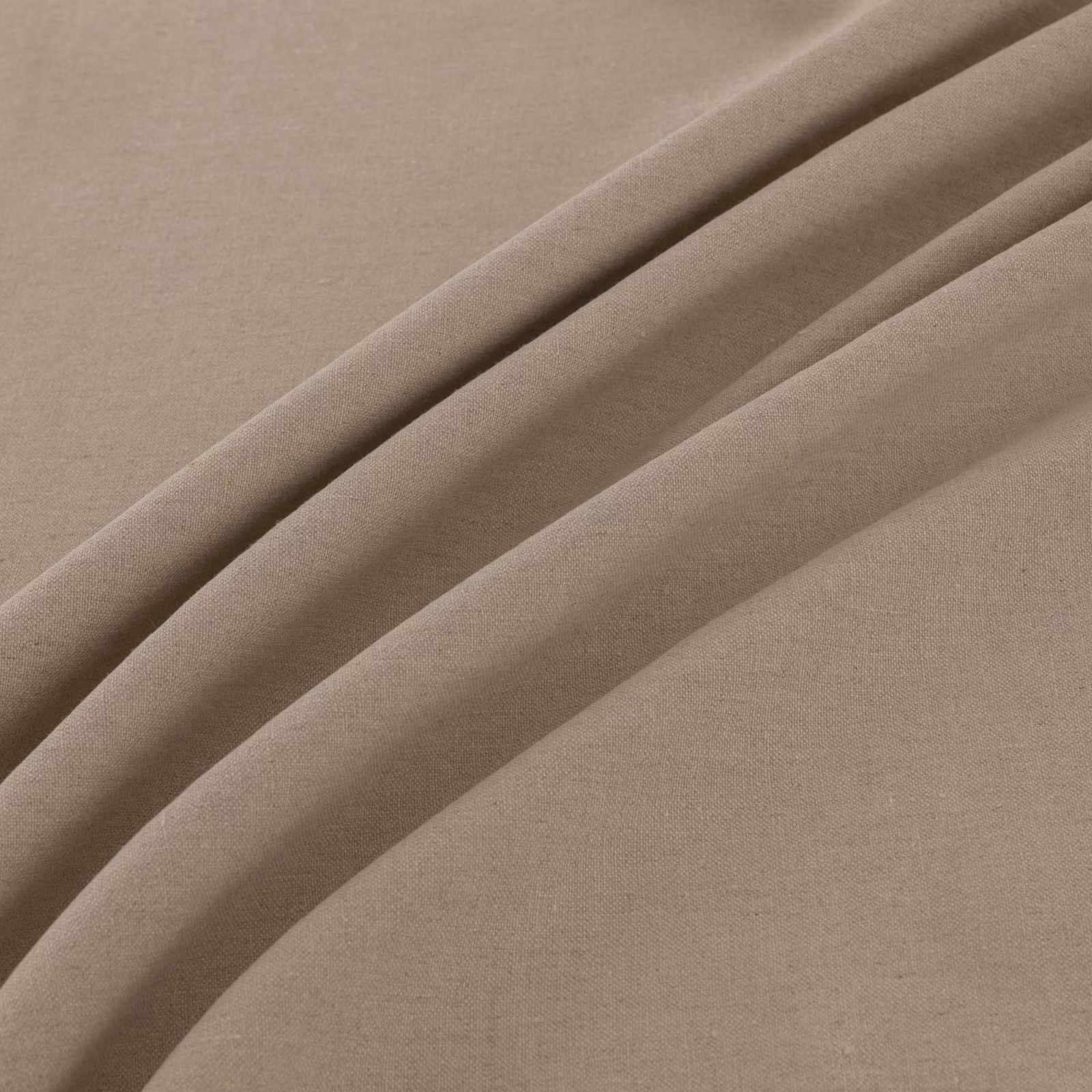 Warm natural taupe plain weave fabric draped into soft, fluid folds
