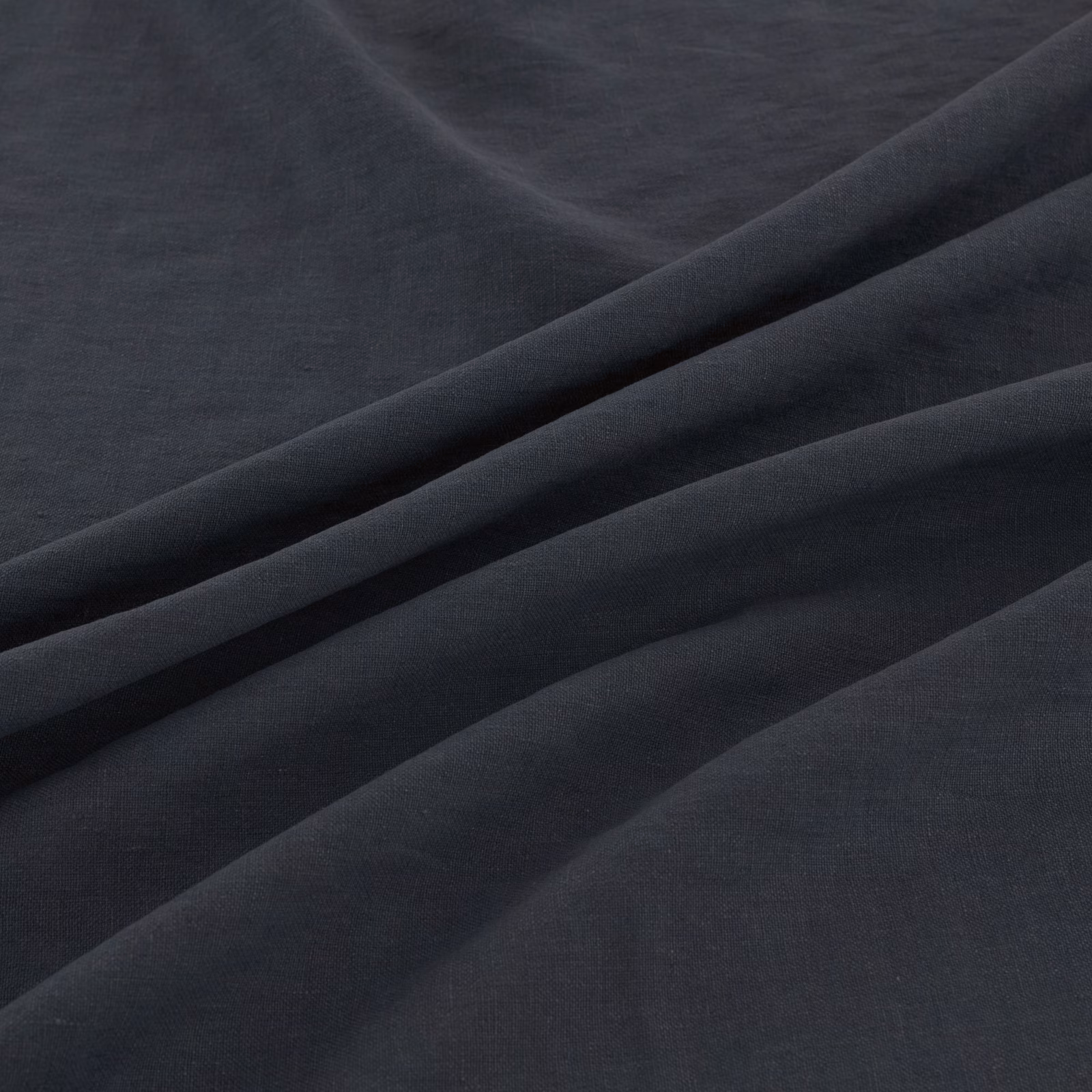 Deep blue-charcoal fine weave falling into soft sweeping folds