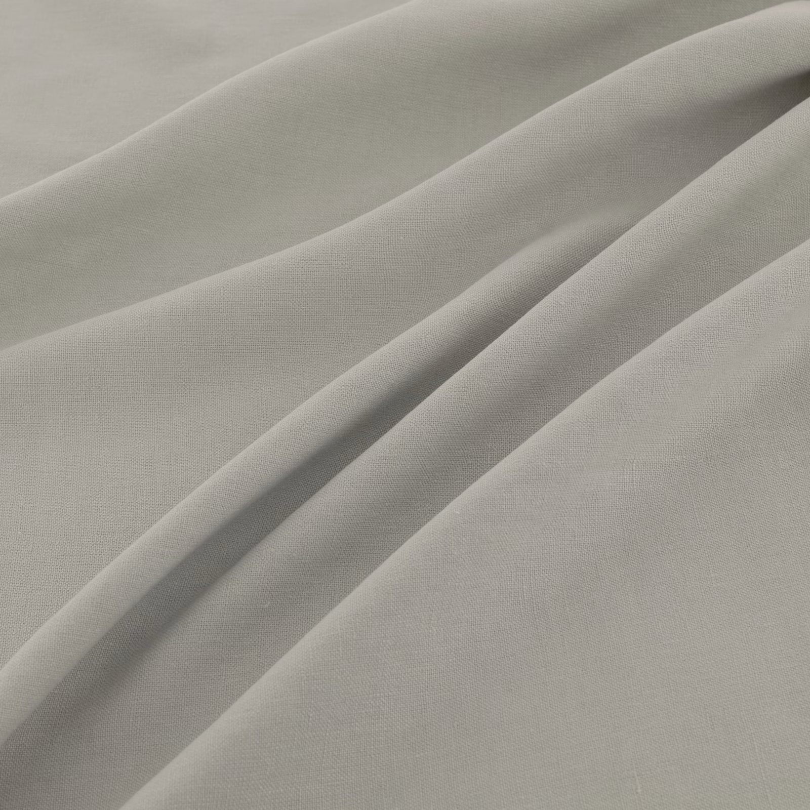 Pale grey-green fine-weave fabric gathered into soft diagonal folds