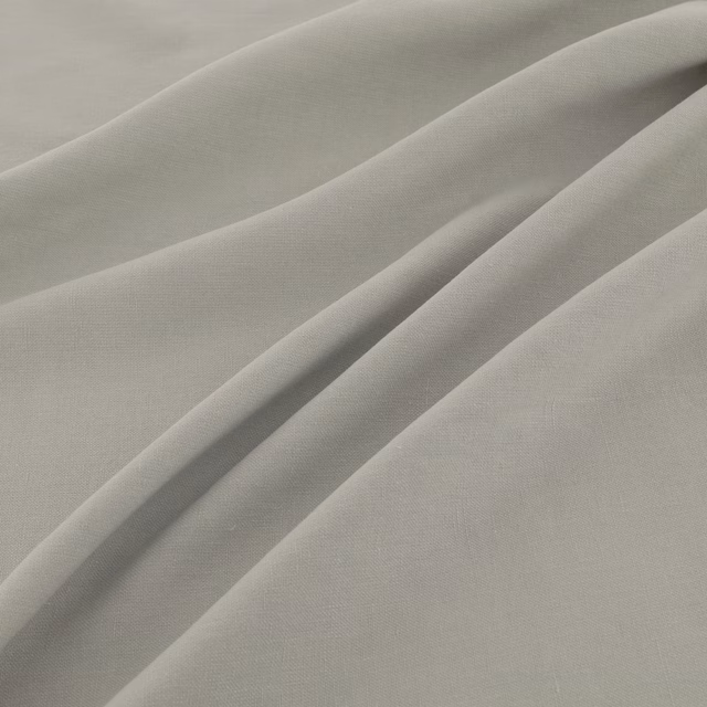 Pale grey-green fine-weave fabric gathered into soft diagonal folds