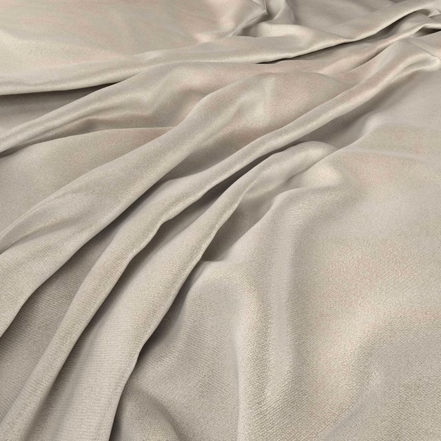 Warm ivory-bone fabric with fine weave and soft sheen in flowing folds