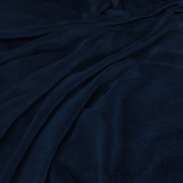 Deep ink-navy textile with fine grain, soft folds and restrained blue sheen