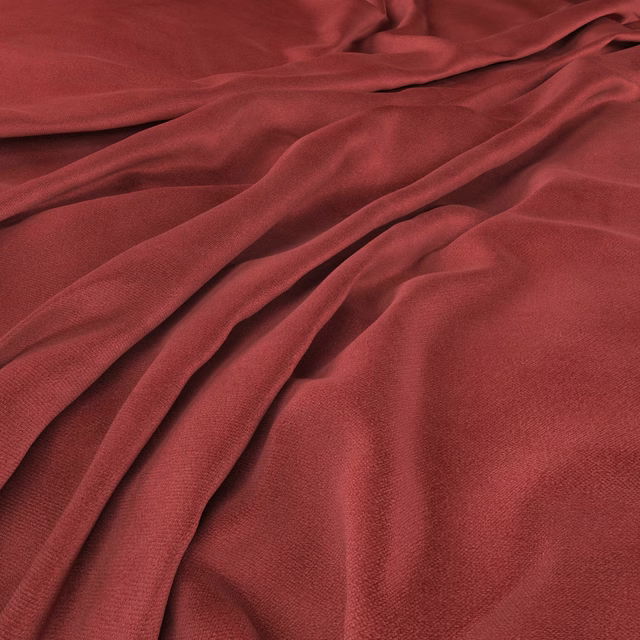 Deep pillarbox-red woven cloth gathered into softly lustrous, flowing folds