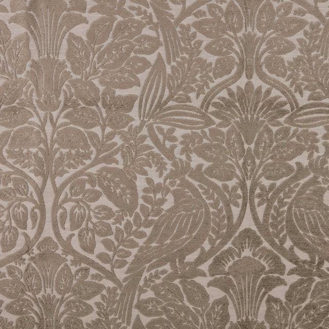 Close-up of warm taupe damask with leafy floral motifs and textured weave