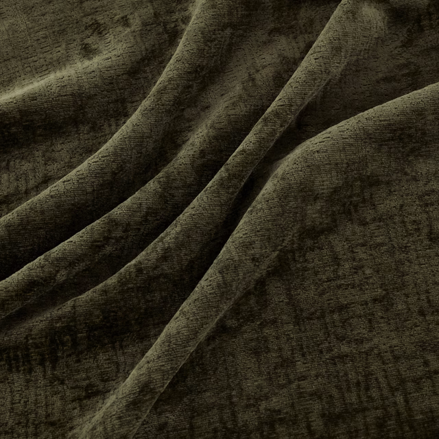 Deep hunter olive fabric with plush mottled texture folded into soft ridges