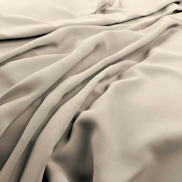 Pale bone fabric with smooth fluid folds and softly shadowed sheen