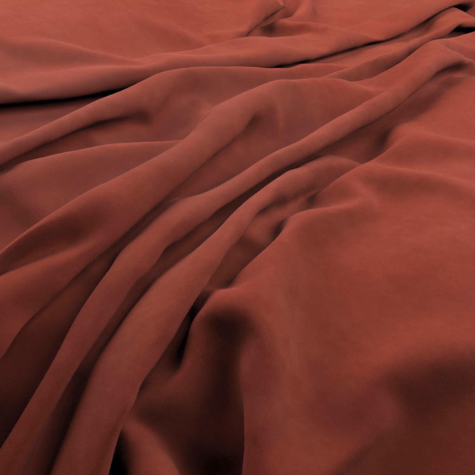 Deep oxblood fabric falling in fluid folds with a soft, muted sheen