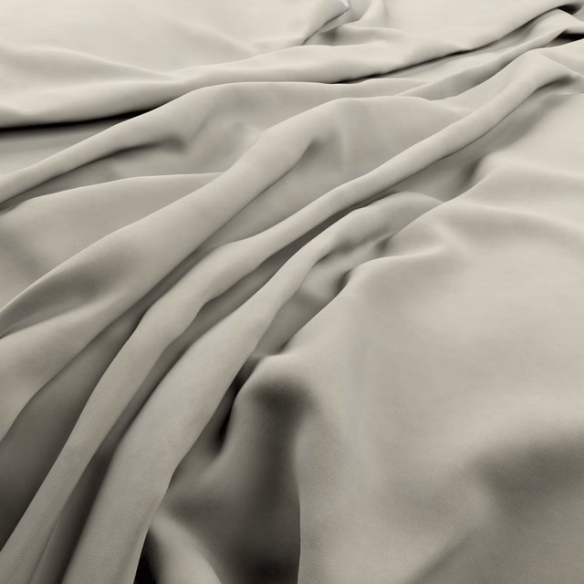 Pale smoke-grey fabric gathered into smooth folds with darker shaded creases