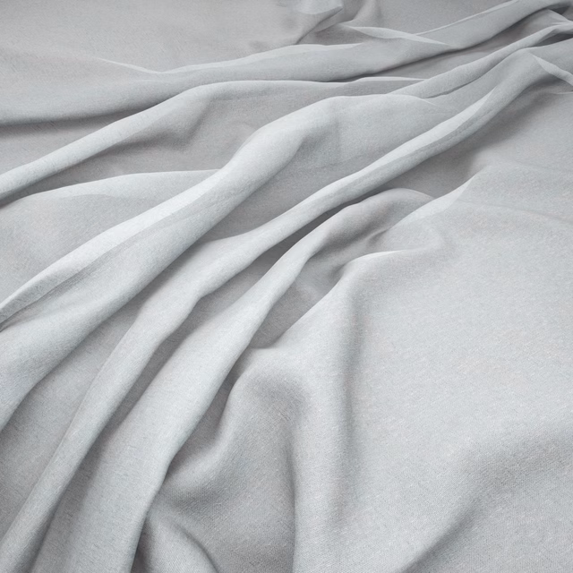 Pale mist-grey fabric falling in fluid folds with a fine, softly textured weave