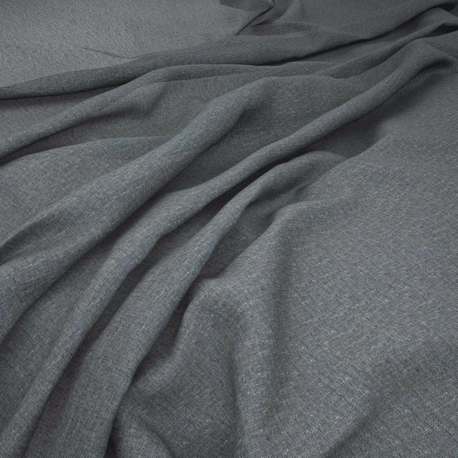 Close-up of charcoal pepper-grey woven cloth with fine texture and soft folds