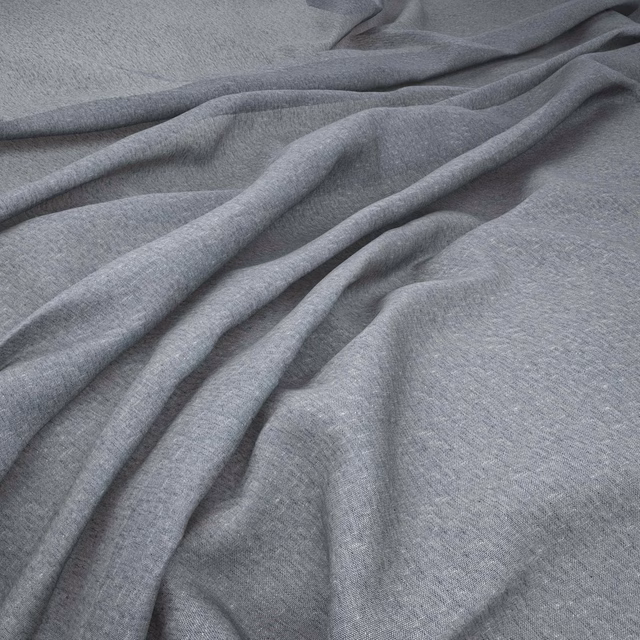 Cool steel-grey woven fabric draped in soft folds with a fine mottled texture