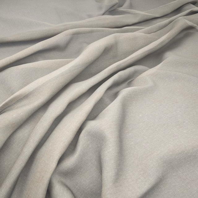 Pale cool-grey Melody Wisp fabric gathered in fluid folds with a fine woven texture