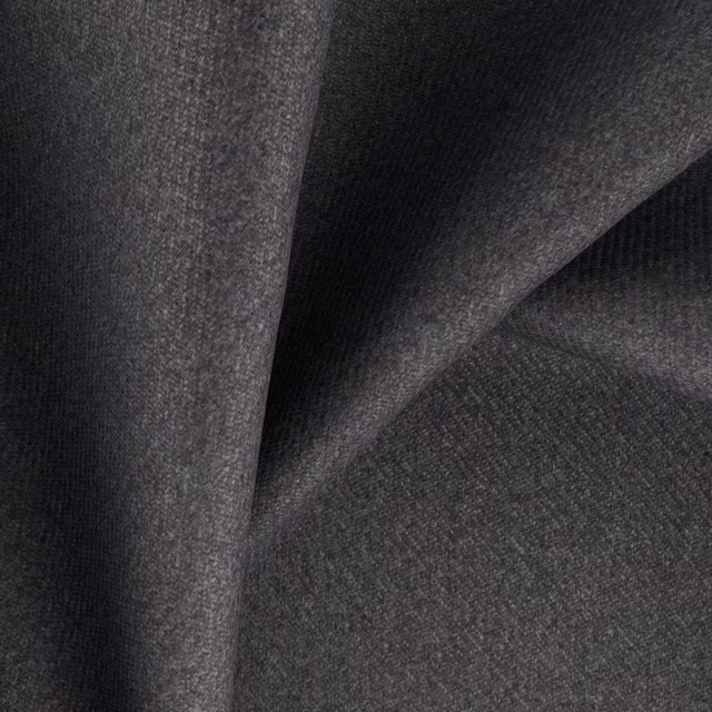 Deep charcoal grey woven textile with subtle tonal texture and sculpted folds