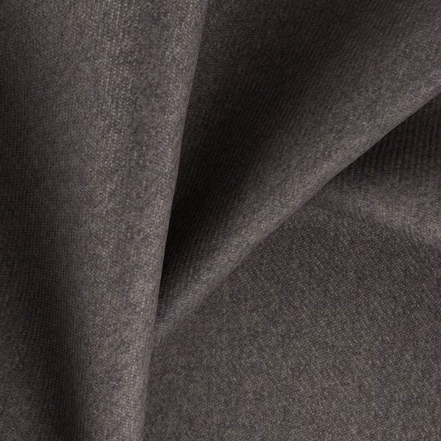 Charcoal brown-grey woven textile folded to show a softly mottled, fine-grained surface