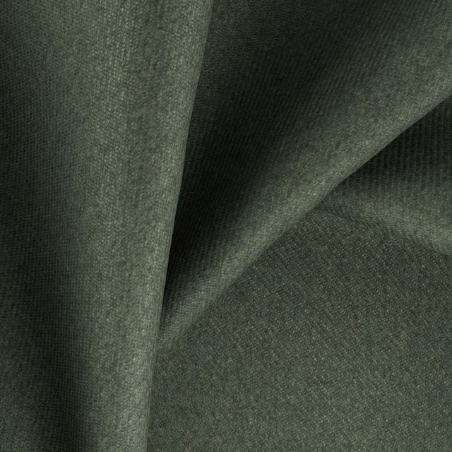 Deep fir-green woven fabric with fine texture shown in overlapping folded layers