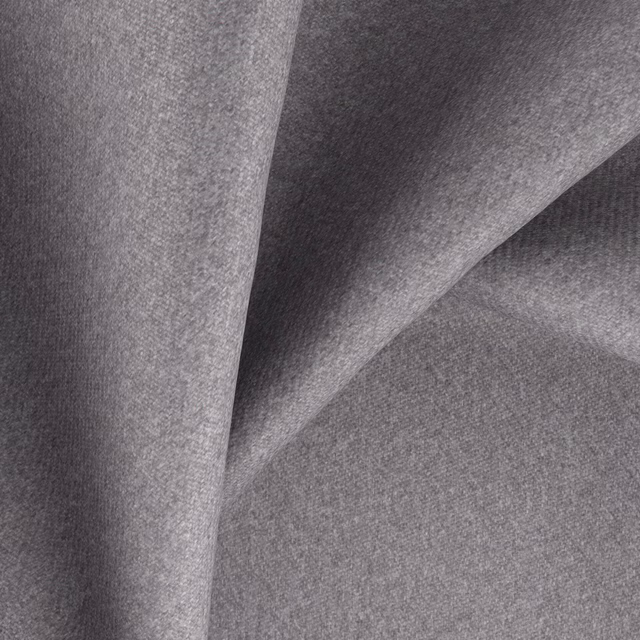 Close-up of cool mid-grey woven fabric with subtle mottled texture and soft folds