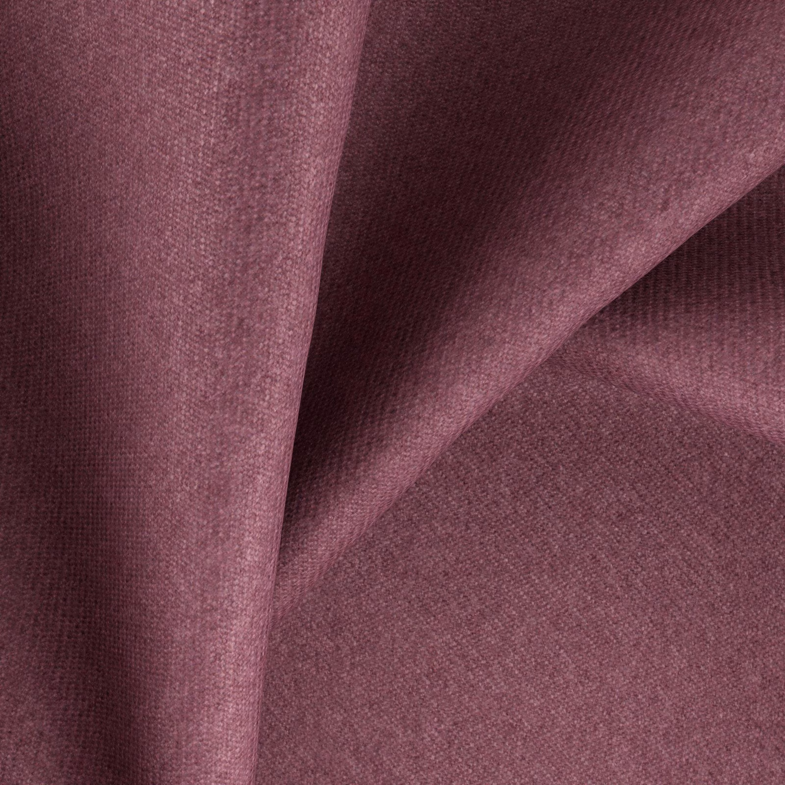 Close-up of dusty mauve plum fabric showing a fine heathered weave and soft folds