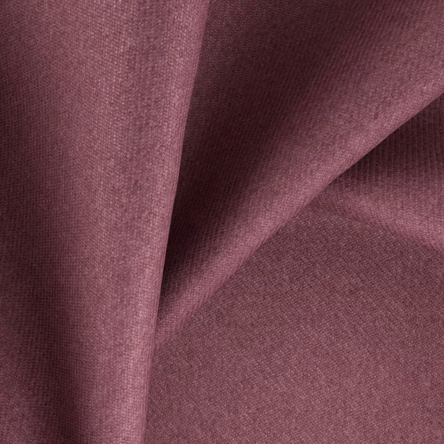 Close-up of dusty mauve plum fabric showing a fine heathered weave and soft folds